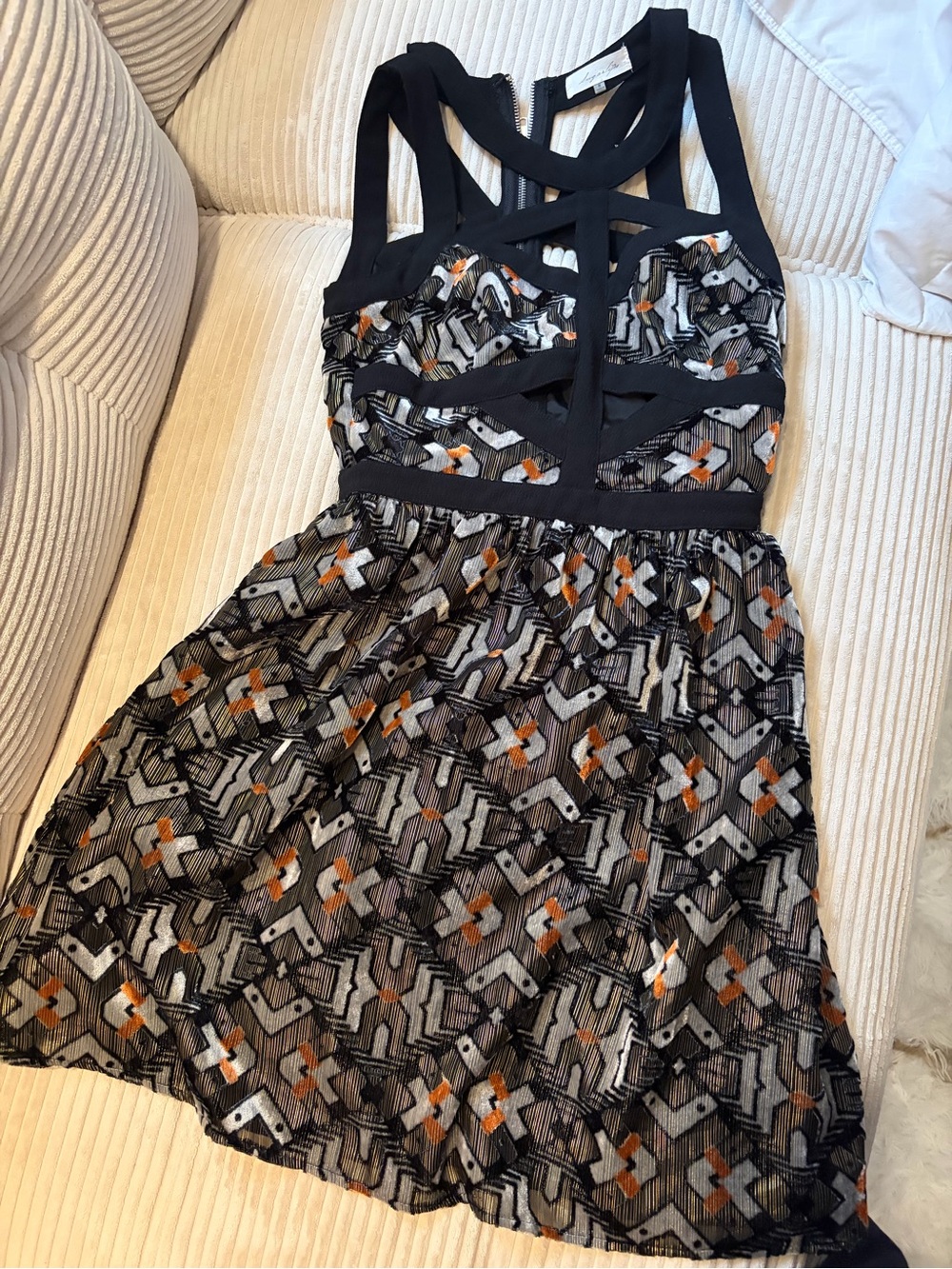 Sugarlips Black Geometric Cutout Mini Dress with Orange Accents